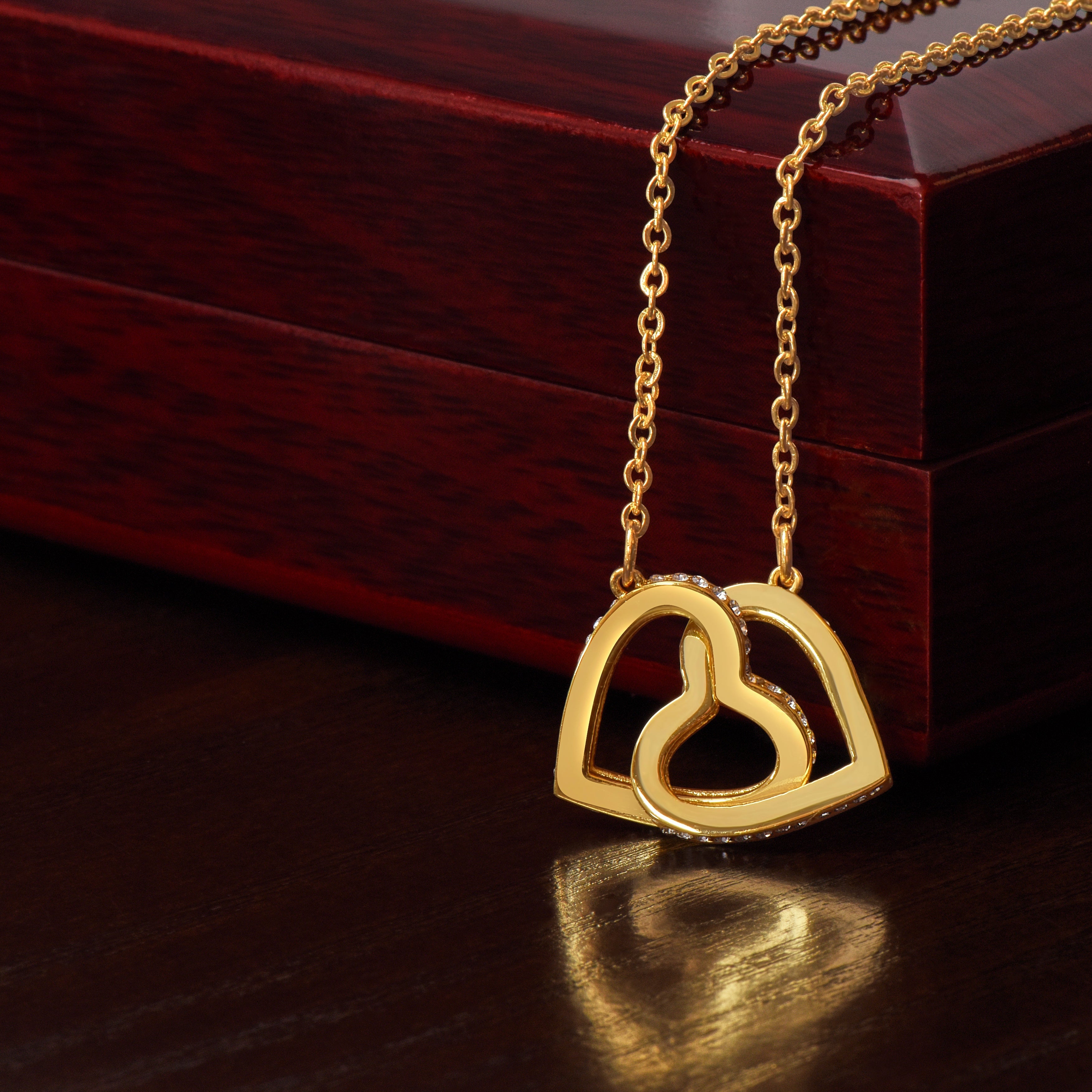"The Interlocking Hearts Necklace – A Symbol of Love, Elegance, and Timeless Style"